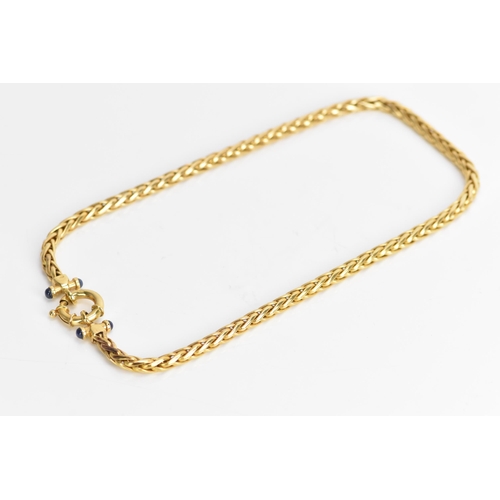 126 - A 9ct yellow gold wheat chain link necklace, having a bolt ring clasp and with four blue sapphire ca... 