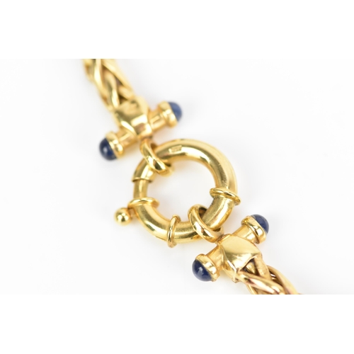 126 - A 9ct yellow gold wheat chain link necklace, having a bolt ring clasp and with four blue sapphire ca... 