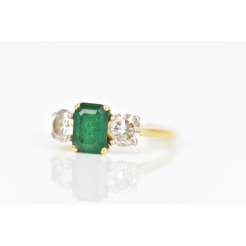 127 - A yellow gold emerald and diamond engagement ring, the emerald cut stone in a claw setting 7.7mm x 5... 