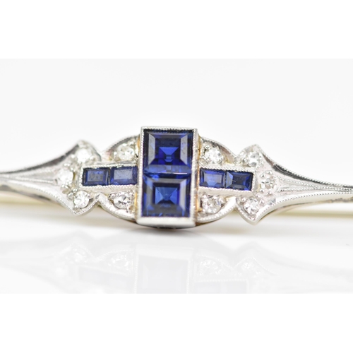 134 - An Art Deco 18ct white gold and platinum bar brooch, set with two central sapphires 3.4mm x 3mm, fla... 