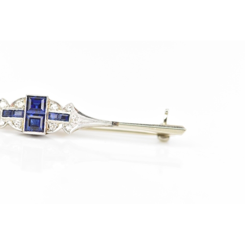 134 - An Art Deco 18ct white gold and platinum bar brooch, set with two central sapphires 3.4mm x 3mm, fla... 