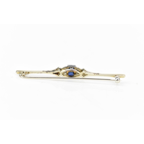 134 - An Art Deco 18ct white gold and platinum bar brooch, set with two central sapphires 3.4mm x 3mm, fla... 