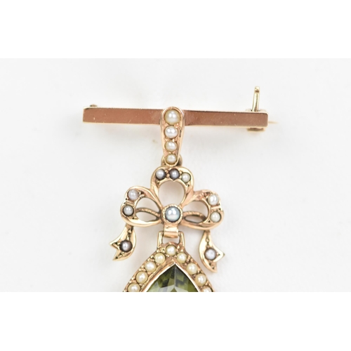 140 - An Edwardian 9ct gold peridot and seed pearl brooch, the peridot pear cut drop 13.5mm x 10mm, surrou... 