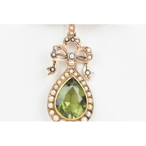 140 - An Edwardian 9ct gold peridot and seed pearl brooch, the peridot pear cut drop 13.5mm x 10mm, surrou... 