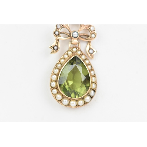 140 - An Edwardian 9ct gold peridot and seed pearl brooch, the peridot pear cut drop 13.5mm x 10mm, surrou... 