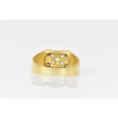 143 - A yellow gold ring, inset with nine paste stones in a cross configuration, ring size T, testing as 1... 