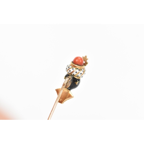 147 - A 19th century blackamoor yellow gold stick pin modelled as a bust wearing a turban, coral, garnet a... 