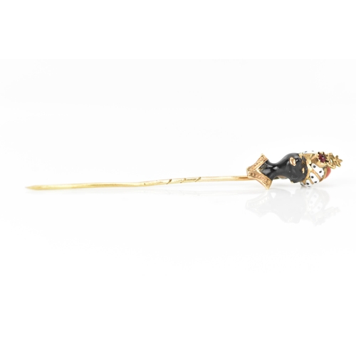 147 - A 19th century blackamoor yellow gold stick pin modelled as a bust wearing a turban, coral, garnet a... 