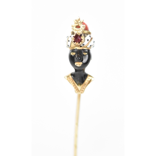 147 - A 19th century blackamoor yellow gold stick pin modelled as a bust wearing a turban, coral, garnet a... 