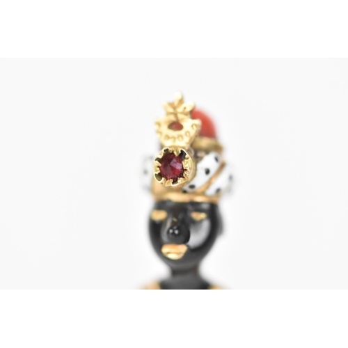 147 - A 19th century blackamoor yellow gold stick pin modelled as a bust wearing a turban, coral, garnet a... 