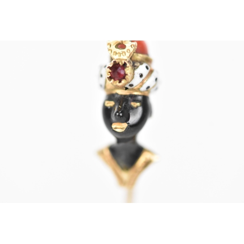 147 - A 19th century blackamoor yellow gold stick pin modelled as a bust wearing a turban, coral, garnet a... 