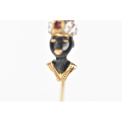 147 - A 19th century blackamoor yellow gold stick pin modelled as a bust wearing a turban, coral, garnet a... 