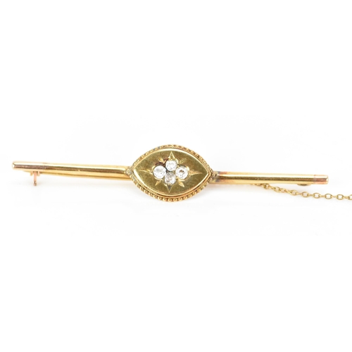 152 - A Victorian yellow metal bar brooch, having four old cut diamonds to the centre creating a floral de... 