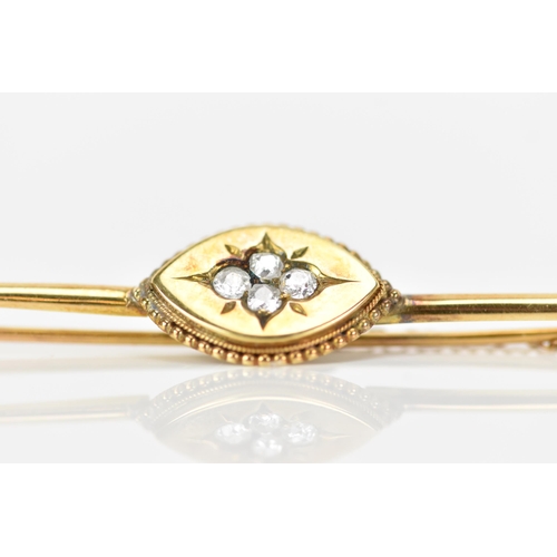 152 - A Victorian yellow metal bar brooch, having four old cut diamonds to the centre creating a floral de... 