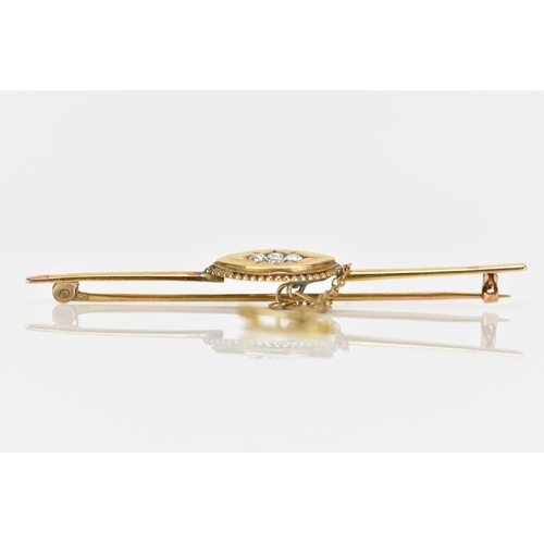 152 - A Victorian yellow metal bar brooch, having four old cut diamonds to the centre creating a floral de... 