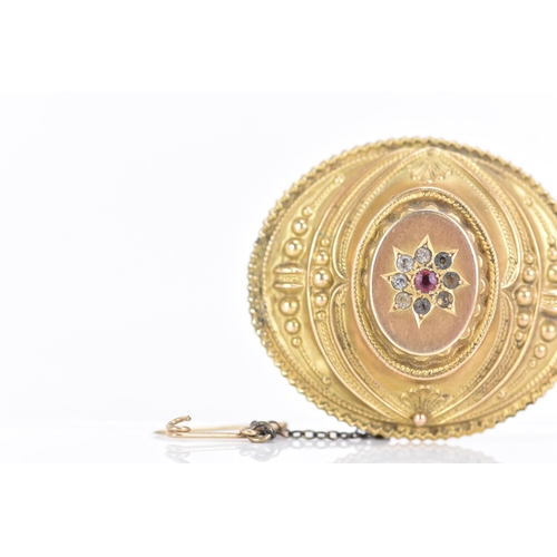 157 - A Victorian 9ct gold Etruscan revival mourning brooch, of oval foliate design, with a central ruby s... 