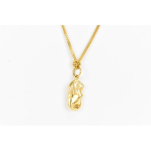 162 - An 18ct yellow gold necklace with two 22ct gold pendants, the curb chain link necklace having a bolt... 