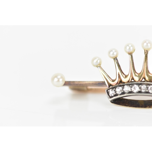 165 - A Victorian yellow metal pearl and diamond coronet/crown brooch, the crown inset with a band of nine... 