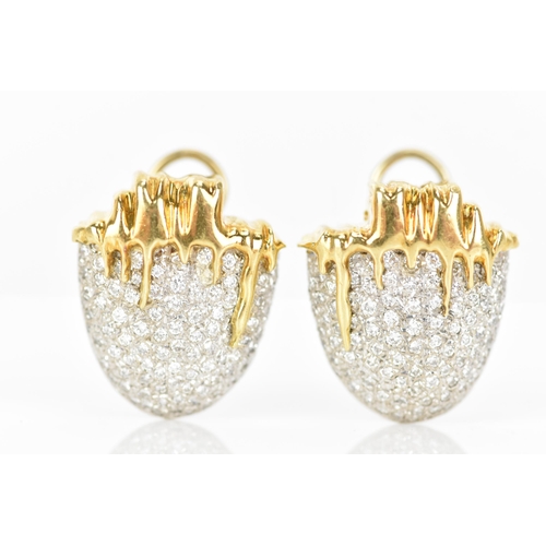 173 - A pair of 18ct yellow and white gold diamond pave set earrings, each fashioned as acorns with drop d... 