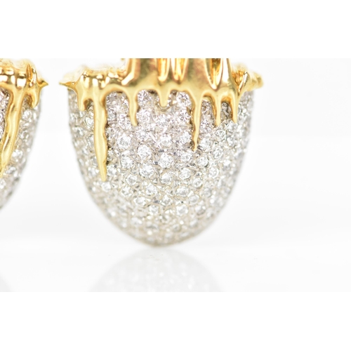 173 - A pair of 18ct yellow and white gold diamond pave set earrings, each fashioned as acorns with drop d... 