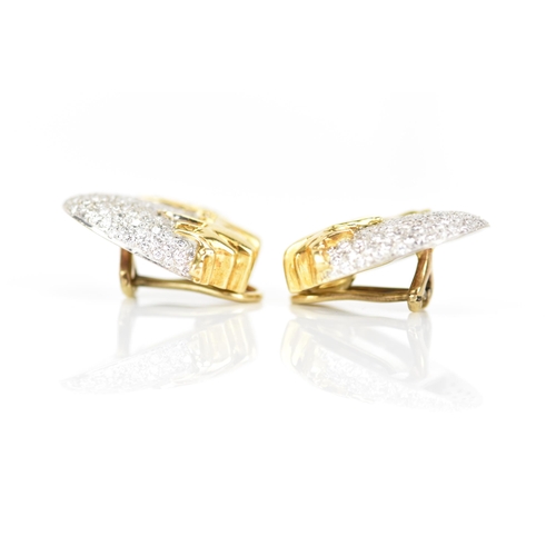 173 - A pair of 18ct yellow and white gold diamond pave set earrings, each fashioned as acorns with drop d... 