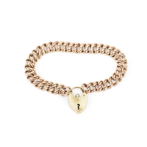 174 - A 9ct rose gold double curb link bracelet, with a yellow gold heart shaped padlock clasp, 16.5cm, 9.... 