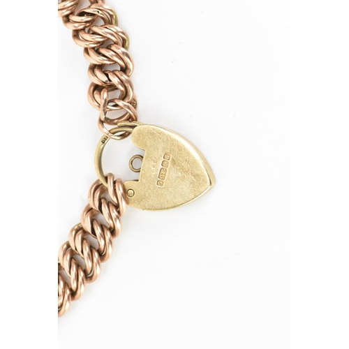 174 - A 9ct rose gold double curb link bracelet, with a yellow gold heart shaped padlock clasp, 16.5cm, 9.... 