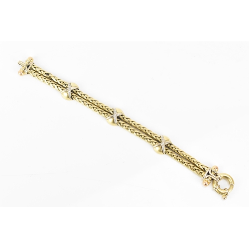 177 - An 18ct gold double spegia bracelet, with three cross and domed sections, each set with fifteen roun... 