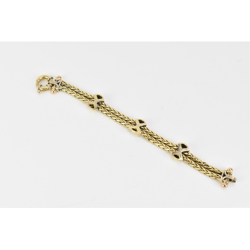 177 - An 18ct gold double spegia bracelet, with three cross and domed sections, each set with fifteen roun... 