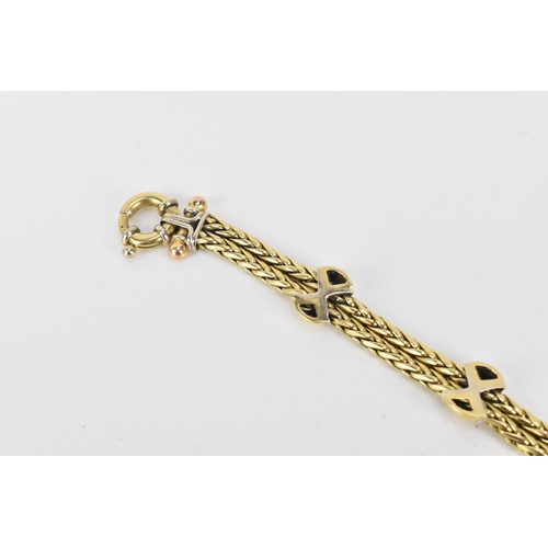 177 - An 18ct gold double spegia bracelet, with three cross and domed sections, each set with fifteen roun... 