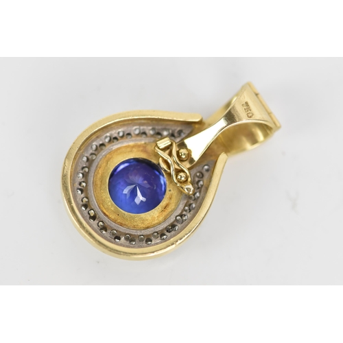 180 - An 18ct gold tanzanite and diamond pendant, the tanzanite stone set in a rub over setting, 8.5mm, su... 