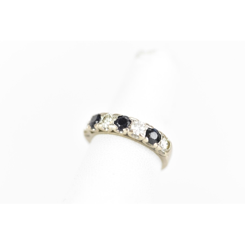 181 - An 18ct white gold half eternity ring, set with three sapphires, each approx 3.3mm x 3mm and four ro... 