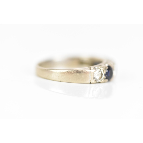 181 - An 18ct white gold half eternity ring, set with three sapphires, each approx 3.3mm x 3mm and four ro... 