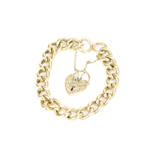 185 - A 9ct rose gold curb link chain bracelet, having a scroll engraved heart shaped padlock clasp and sa... 