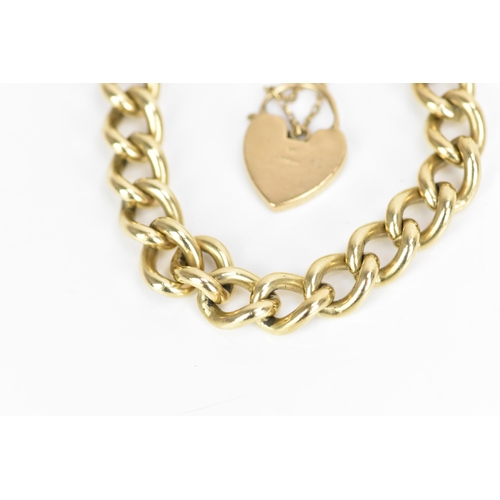 185 - A 9ct rose gold curb link chain bracelet, having a scroll engraved heart shaped padlock clasp and sa... 