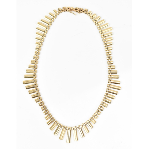 206 - A 9ct gold Cleopatra style fringe necklace, having graduated elliptical bars and an open box clasp, ... 