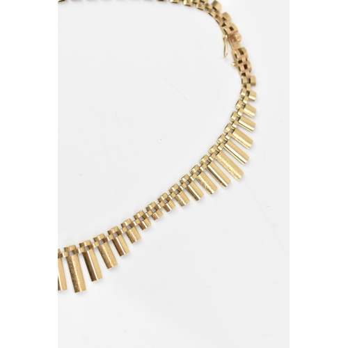 206 - A 9ct gold Cleopatra style fringe necklace, having graduated elliptical bars and an open box clasp, ... 