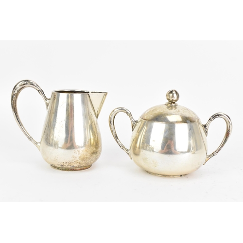 21 - An early 20th century 800 silver three piece tea service, consisting of a teapot 17cm high x 16.5cm ... 