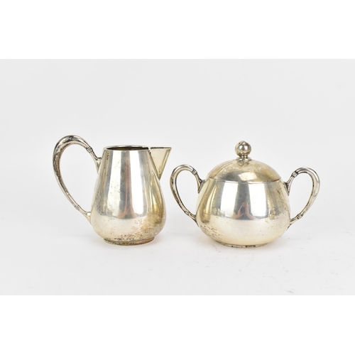 21 - An early 20th century 800 silver three piece tea service, consisting of a teapot 17cm high x 16.5cm ... 