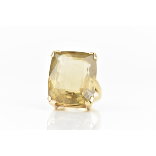 210 - An 18ct yellow gold dress ring, inset with a large faceted cut citrine, 21.1mm x 17.8mm, with a pier... 