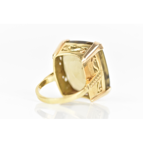 210 - An 18ct yellow gold dress ring, inset with a large faceted cut citrine, 21.1mm x 17.8mm, with a pier... 