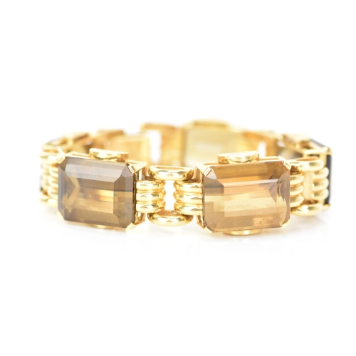 211 - A vintage 18ct gold cocktail bracelet, inset with five graduating faceted cut smokey quartz stones i... 