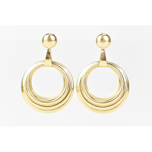 212 - A pair of 14ct yellow gold hoop earrings, each having suspension rings and butterfly backs, stamped ... 