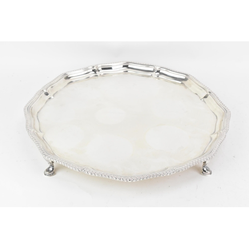 217 - A Victorian silver tray, by Edward Barnard & Sons Ltd, hallmarked London 1896, of shaped circular fo... 