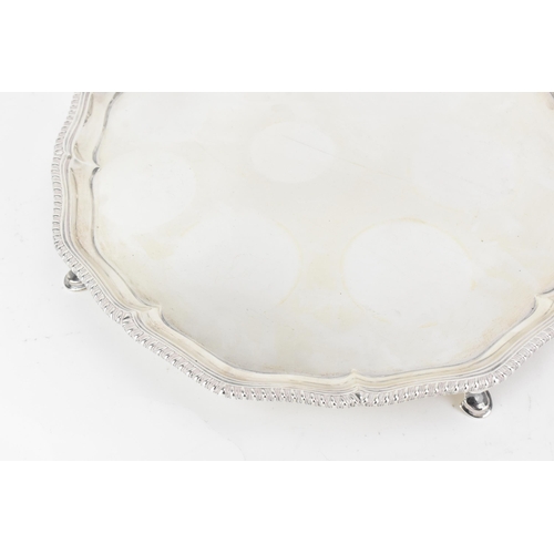 217 - A Victorian silver tray, by Edward Barnard & Sons Ltd, hallmarked London 1896, of shaped circular fo... 