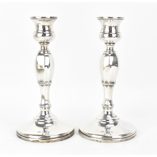 218 - A pair George VI silver candlesticks, by Mappin & Webb, hallmarked Birmingham 1936, the columns of o... 