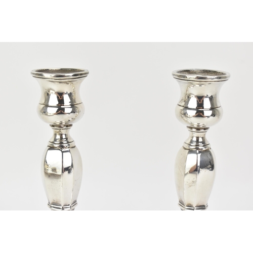 218 - A pair George VI silver candlesticks, by Mappin & Webb, hallmarked Birmingham 1936, the columns of o... 