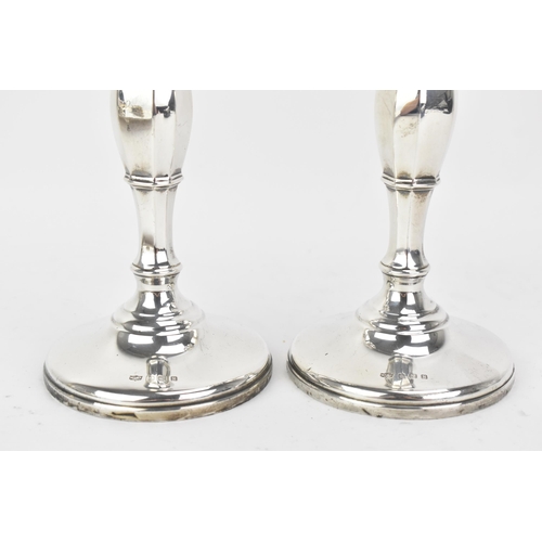 218 - A pair George VI silver candlesticks, by Mappin & Webb, hallmarked Birmingham 1936, the columns of o... 