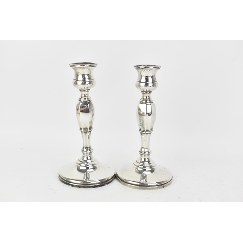 218 - A pair George VI silver candlesticks, by Mappin & Webb, hallmarked Birmingham 1936, the columns of o... 