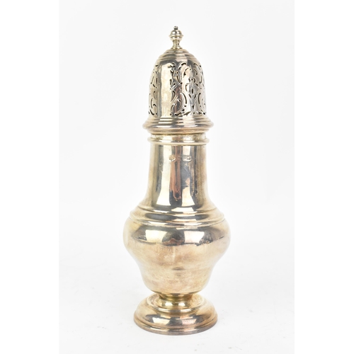 223 - An early 20th century silver sugar castor, makers marks and hallmarks rubbed, having a turned finial... 